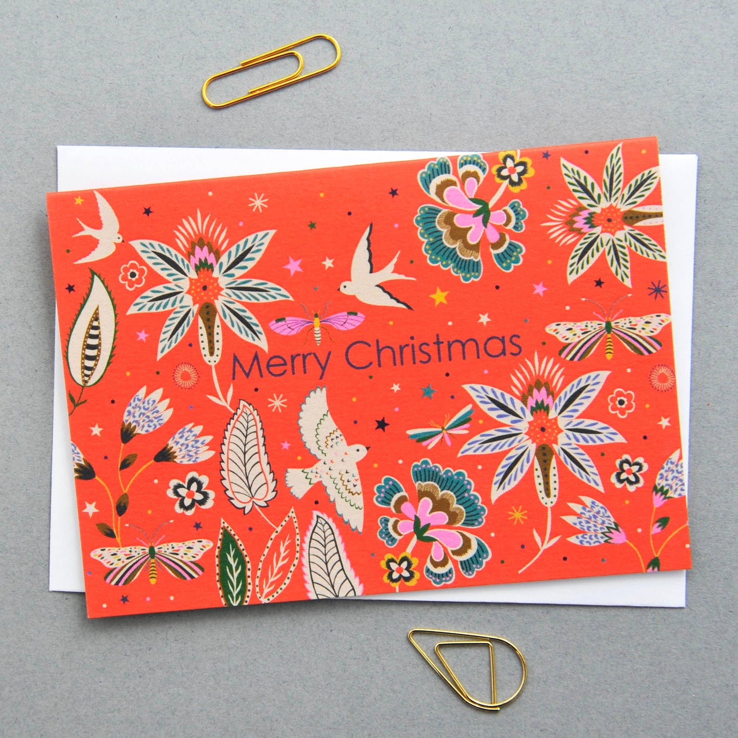 Christmas Holiday Festive Season Notecards. Can be used as small Christmas festive notecards and attached to gifts for the holiday season. Illustrated featuring colourful flora and fauna against a red background with the words Merry Christmas.