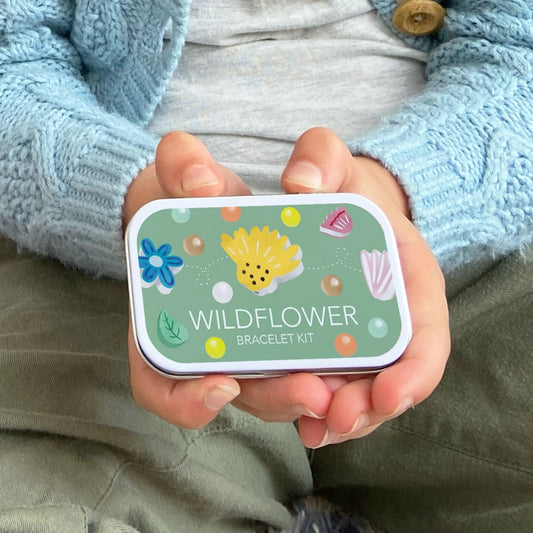 A beautiful gift tin containing elastic and beads to create this wildflower bracelet. The elastic comes with metal ends to aid the beading process for young children. The kit is presented in a rectangular tin