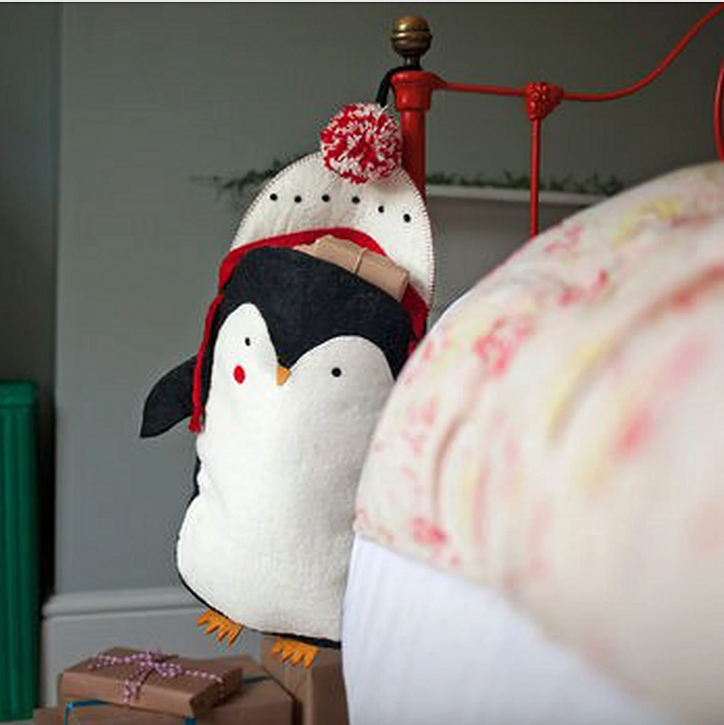 Red Pete the Penguin Felt Stocking for kids. Wearing a white and red hat with a woolly pom pom. Sustainably made.