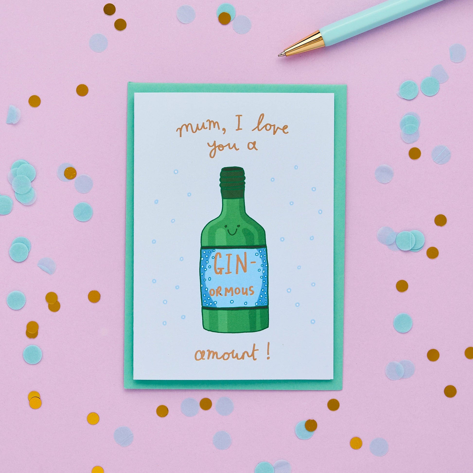 Original, hand drawn design featuring a characterful bottle of gin. Written in a striking, hand lettered font and finished with gold foil, the puntastic message on the front of this unique card reads "Mum I love you a ginormous amount "