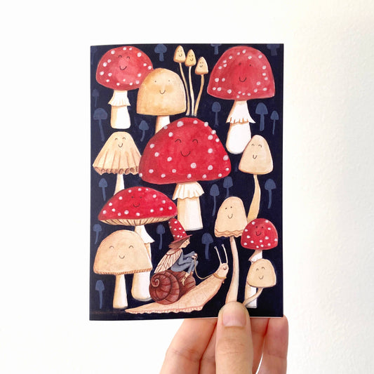 Elf riding a snail in a toadstool forest greetings card