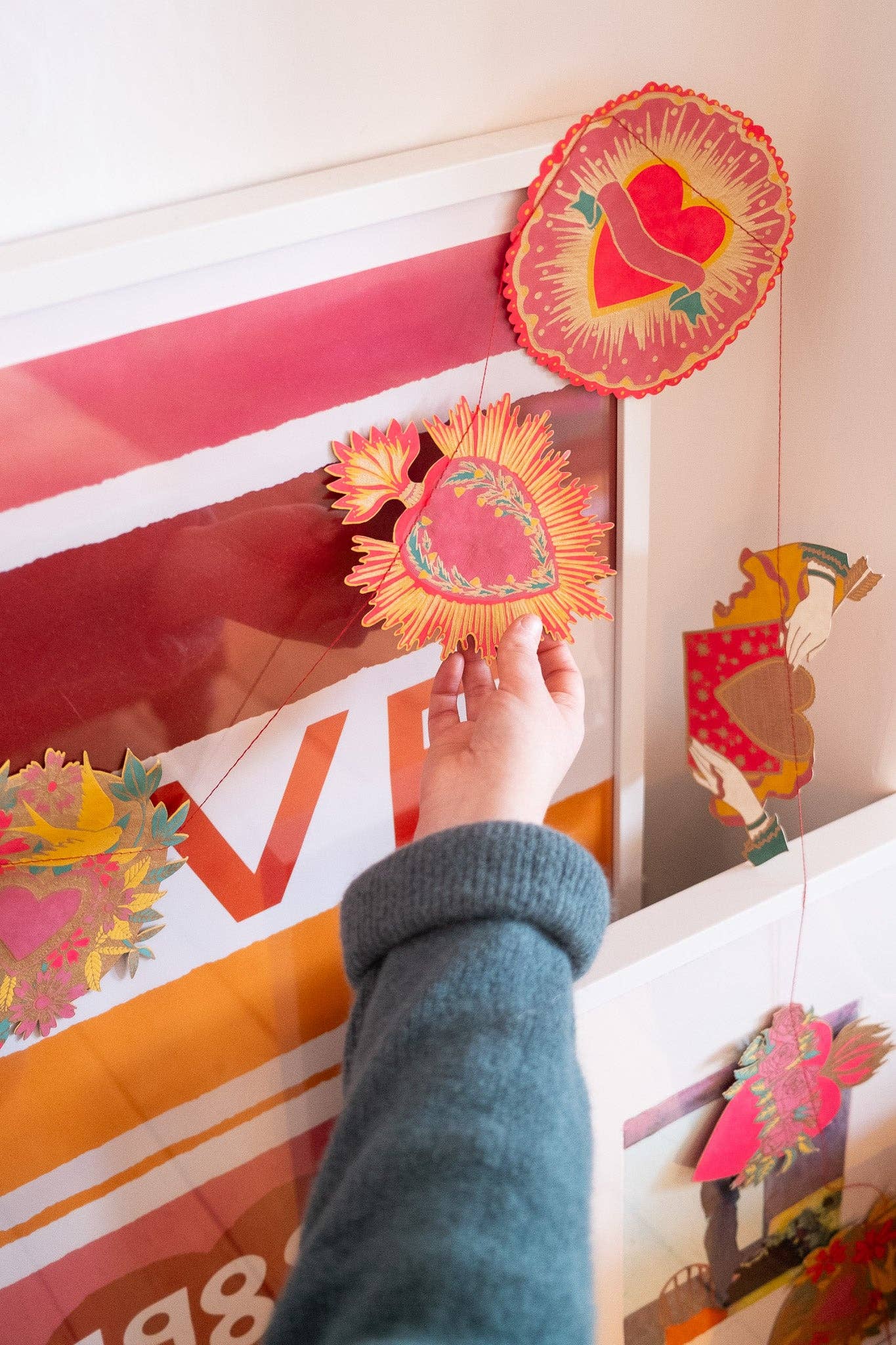 Inspired by scared hearts and Mexican folk art, this garland is full of kitsch and romance. Ten decorative, bejewelled hearts create the three metre garland.

Includes 10 paper shapes, sewn along strong cotton thread - Screen printed by hand on both sides by talented artisans in Jaipur - Sustainably made from recycled materials