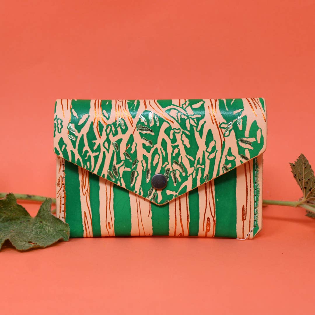 Introducing the newest addition to the Ark Colour Design collection - the Forest Popper Purse! Designed in our Cambridge studio and crafted in Scotland, they have created a striking embossed tree design which is designed to be practical and joyful. Individually hand embossed with both shiny and matte foil.