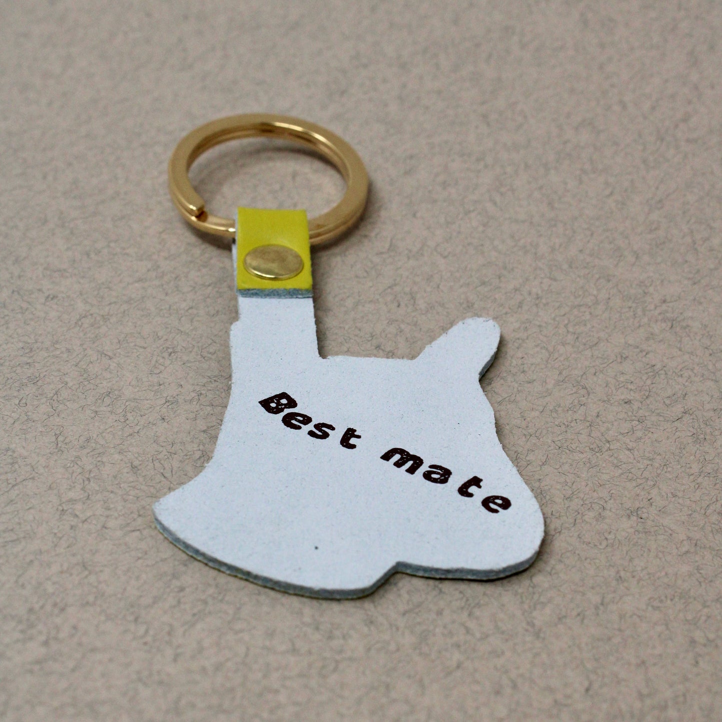 Genuine Leather Dog Keyring. Colourful orange pup with 'best mate' embossed on the reverse. A playful design with a sweet sentiment. Made using the traditional technique of hot foil embossing which ensures a handmade and unique product every time. Made in the UK