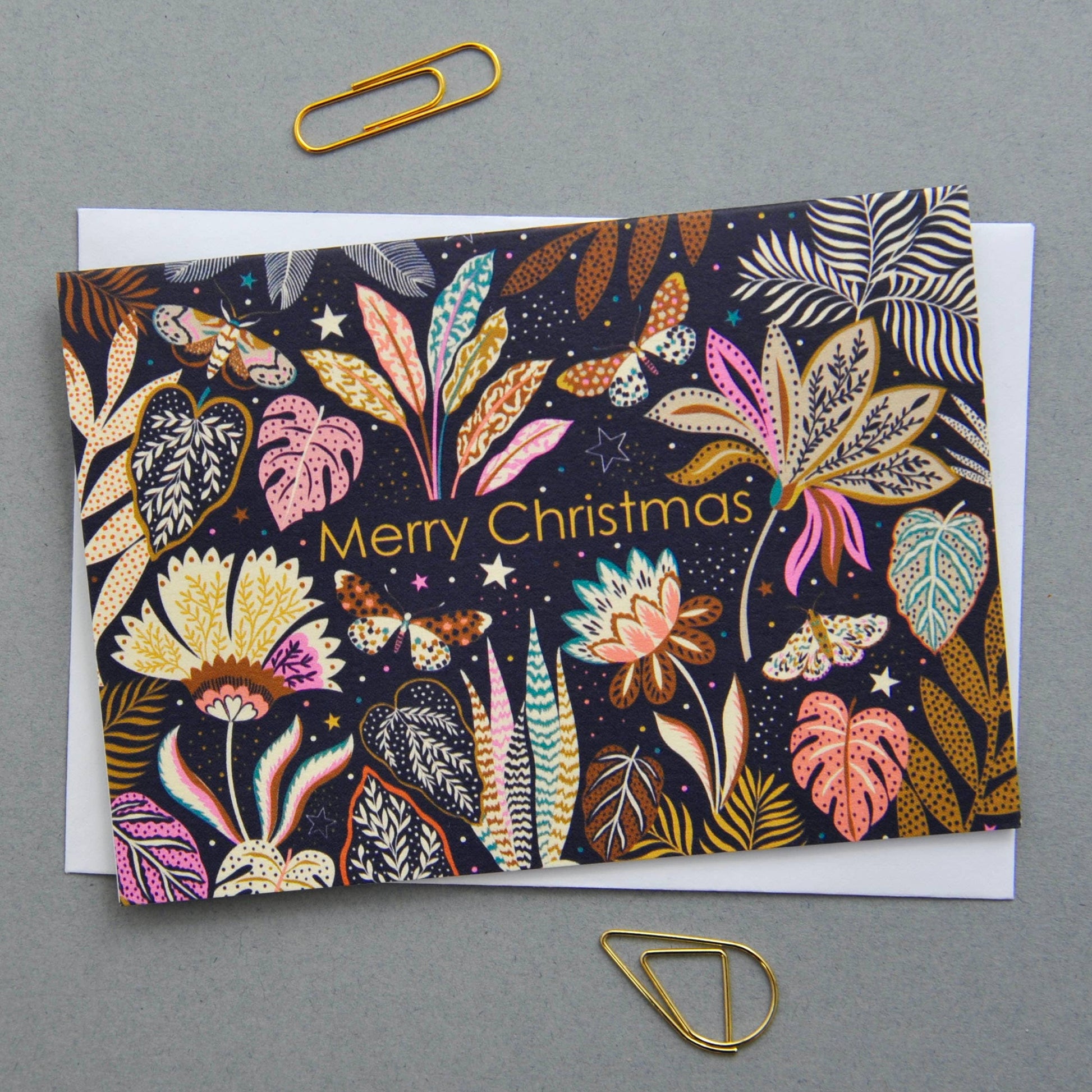 Christmas Holiday Festive Season Notecards. Can be used as small Christmas festive notecards and attached to gifts for the holiday season. Illustrated featuring colourful flora and fauna against a dark background with the words Merry Christmas.