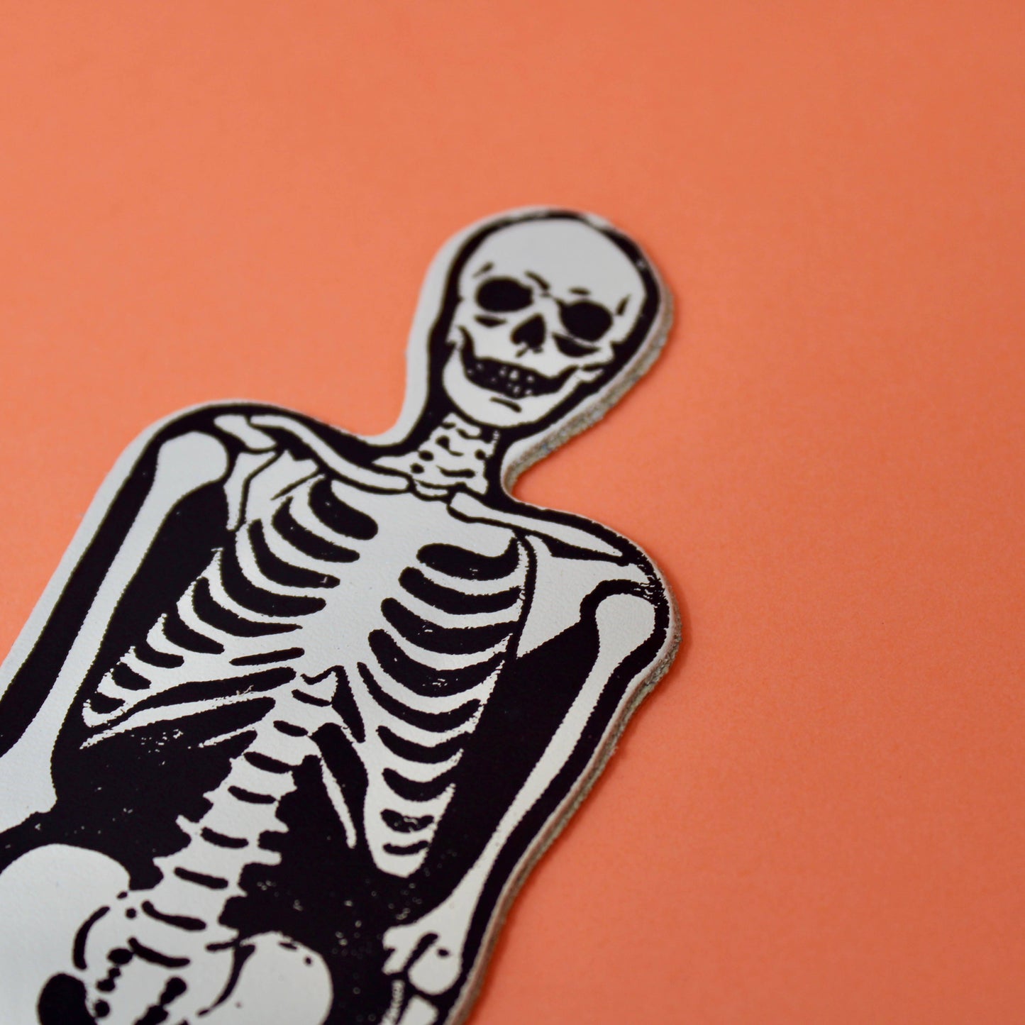 A spooky skeleton leather bookmark embossed with ‘You read right through me’ on the reverse.