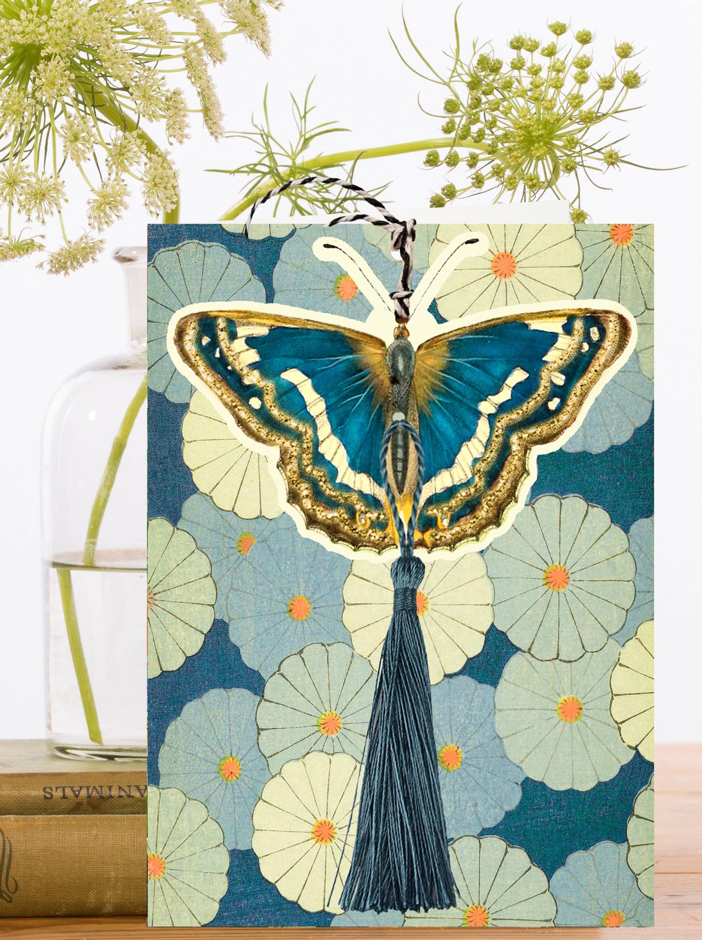 This is not just any greeting card, it's a stunning masterpiece featuring the majestic butterfly with a tassel, set against a vintage floral setting. And to top it off, it even comes with a detachable keepsake, making it the perfect birthday gift!