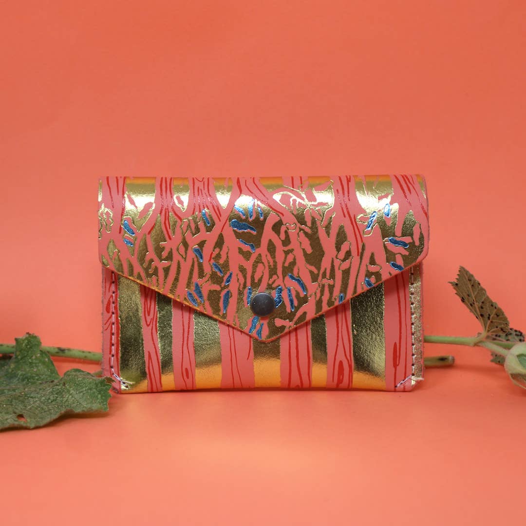 Introducing the newest addition to the Ark Colour Design collection - the Forest Popper Purse! Designed in our Cambridge studio and crafted in Scotland, they have created a striking embossed tree design which is designed to be practical and joyful. Individually hand embossed with both shiny and matte foil.