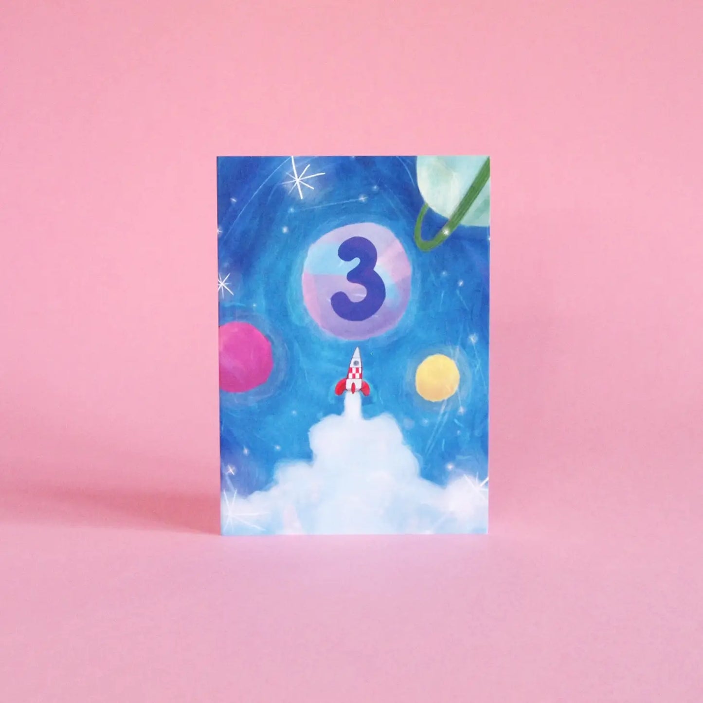 Illustrated 3rd birthday card, featuring space rockets, planets and a galaxy of stars. Sustainably made in the UK