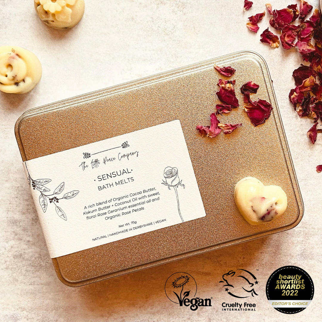 Sensual Bath Melts with rose petals.  Sensual - with the opulent scent of rose geranium essential oil and dried organic rose petals. Each tin contains 12 mini melts.