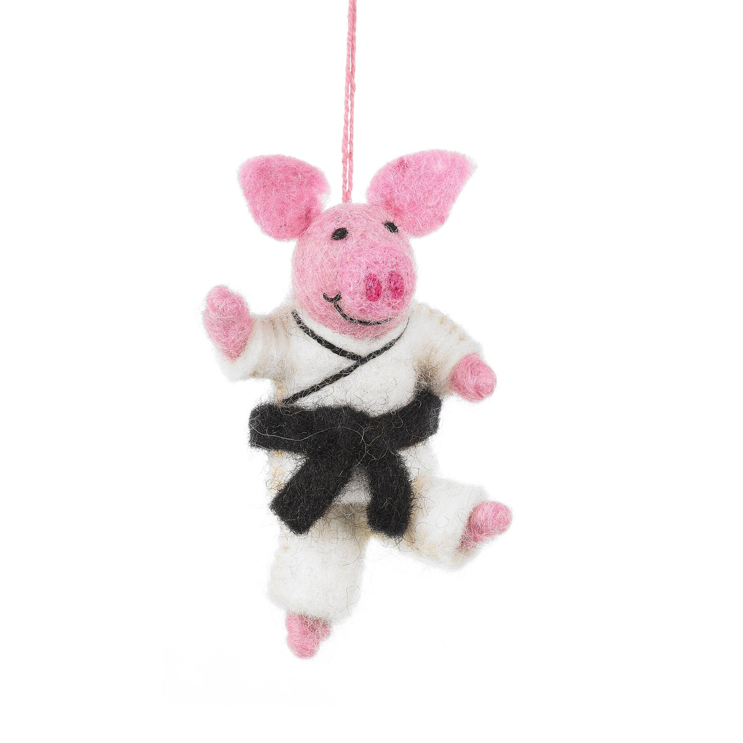 Handmade Felt pig hanging decoration. Dressed in a white karate costume with a black belt. He has wires in this limbs so can be moved in to different karate poses.