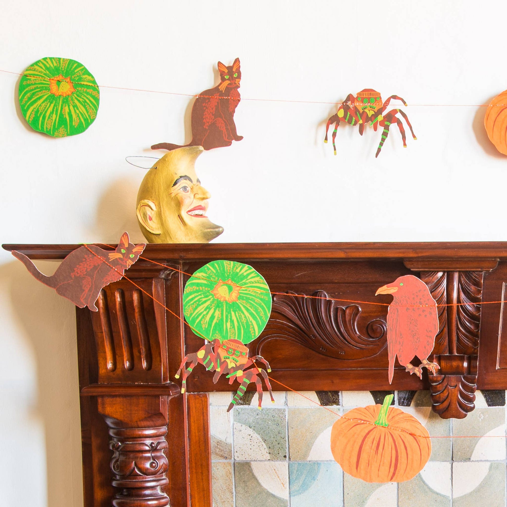 In bold greens and bright oranges, this garland features all the traditional images of Halloween - cats, ravens, spiders and pumpkins!
3 metres long - Includes 10 paper shapes, sewn along strong cotton thread