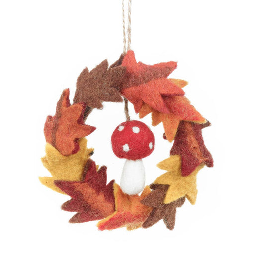 Handmade Felt Autumn Leaves & Toadstool Wreath Decoration. Hanging decoration wreath of leaves with a toadstool in the middle.