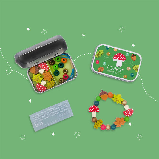 A beautiful gift tin containing elastic &amp; beads to create a beautiful wooden forest-themed bracelet. The elastic comes with metal ends to help children add beads with ease. The tin can be used to store the bracelet, or a special trinket.