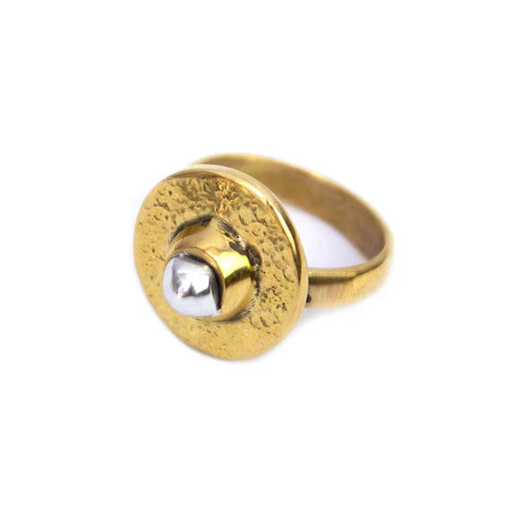 This Mombasa brass round ring is an elegant and striking signature piece. Ethically handmade in Kenya by our team of talented artisans. The brass is hand-hammered to give it a beautiful shimmer, making it an eye-catching accessory. The organic hammered texture and smooth aluminium ‘pearl’ makes this ring a wearable work of art.

Materials: Recycled Brass, Aluminium Pearl in the centre