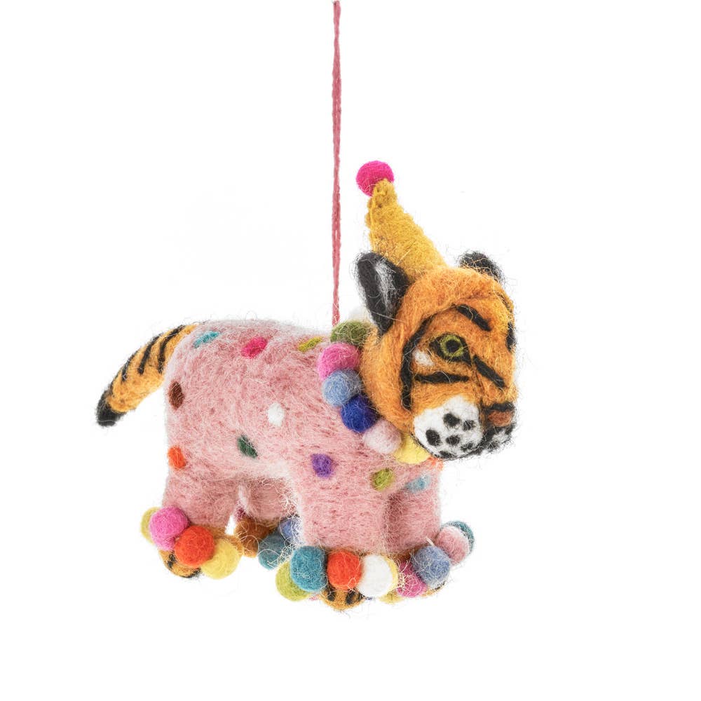 Fiesta Tiger Hanging Party Decoration. Fiesta Tiger is the most vibrant and exciting animal in the entire animal kingdom! Here to add some party cheer to our collection - Fiesta Tiger is made from 100% sustainable New Zealand wool by our skilled Nepalese artisans, under Fairtrade working conditions.