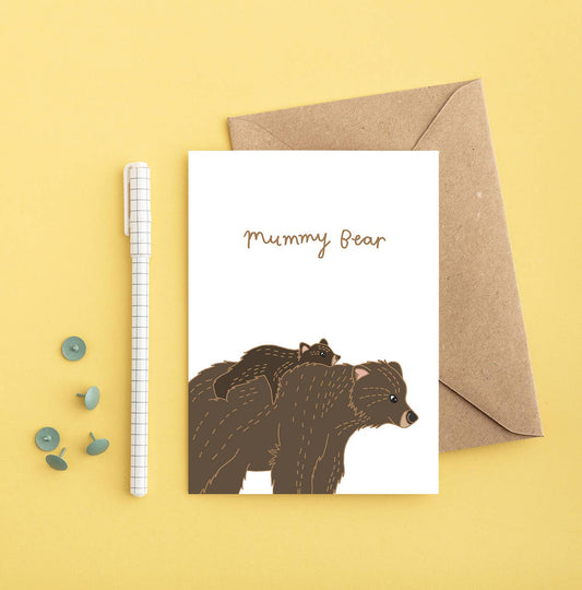 Hand drawn illustration of a brown Mummy bear carrying her little cub. Beautiful card for Mother's Day or Mum's birthday. With the words Mummy Bear at the top of the card.