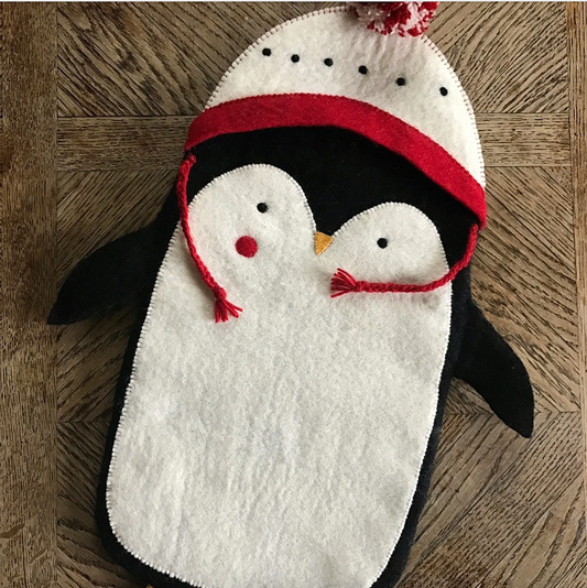 Red Pete the Penguin Felt Stocking for kids. Wearing a white and red hat with a woolly pom pom. Sustainably made.