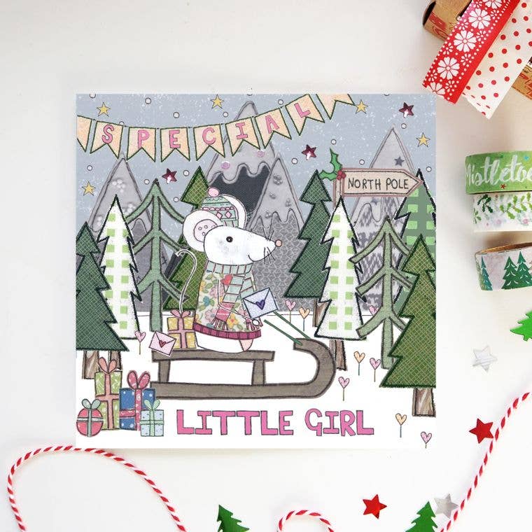 A Special Little Girl Christmas Card. A cosy little mouse, decked out in her festive jumper and hat, embarks on a sleigh ride through the snowy North Pole to deliver presents and cards.