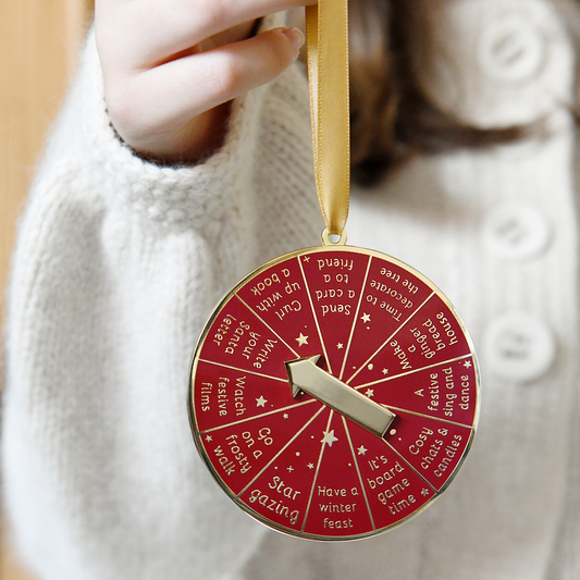 12 Days Of Advent Ideas Spinning Christmas Decoration. A beautiful alternative to an advent calendar, this interactive spinning Christmas decoration, with 12 festive activity ideas, will help to inspire Christmas magic on each day of the holiday season. A beautiful and unique Christmas ornament, it's the perfect heirloom tree decoration for inspiring family Christmas traditions.