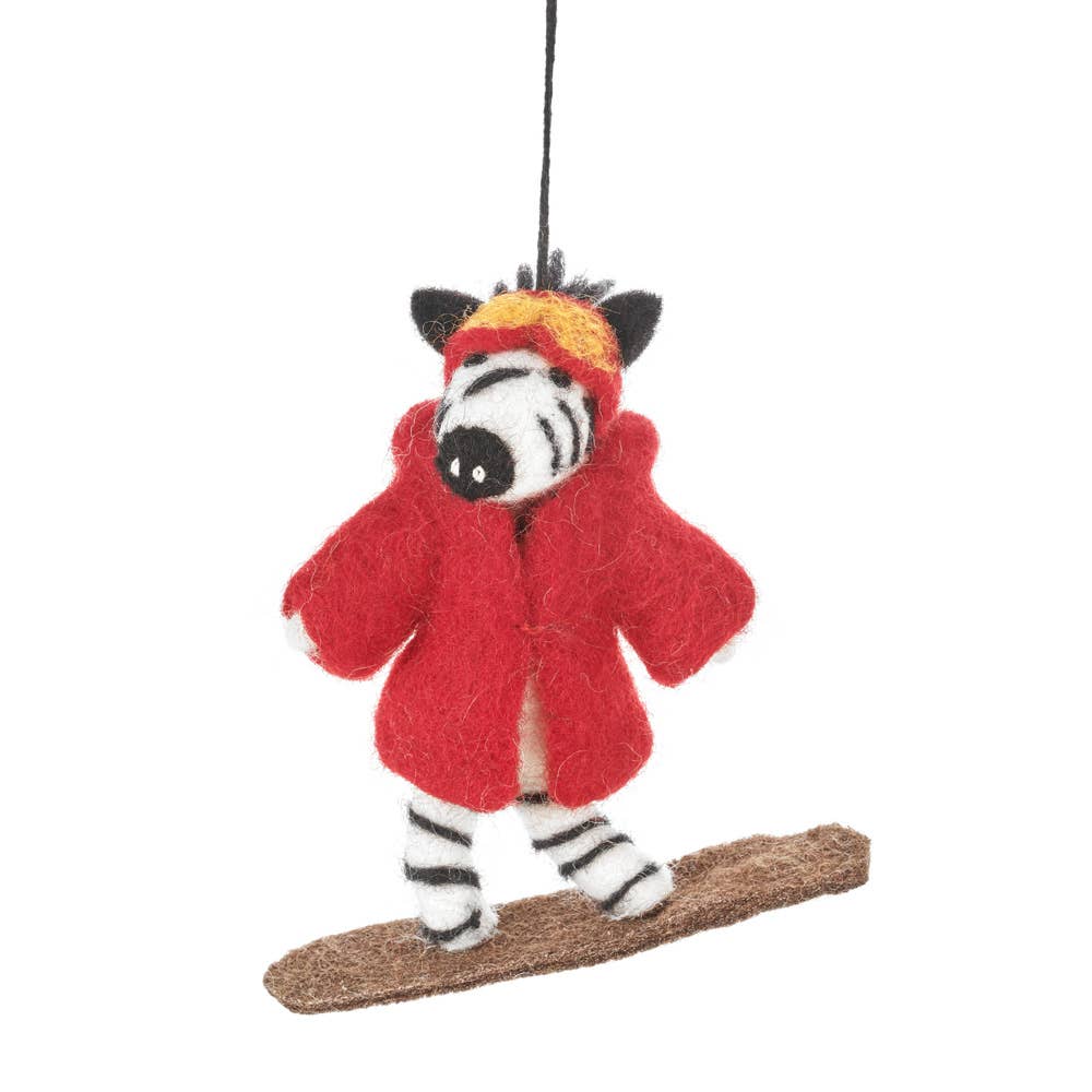 Zippy Zebra Snowboarding Hanging Christmas Decoration. This speedy Snowboarding Zebra looks the part with her matching wet felted goggles and coat in red that have been handstitched to her needle felted body (so she can't lose them!). She wouldn't be complete without a wet felted snowboard